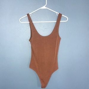 Burnt orange bodysuit. Perfect for layering.